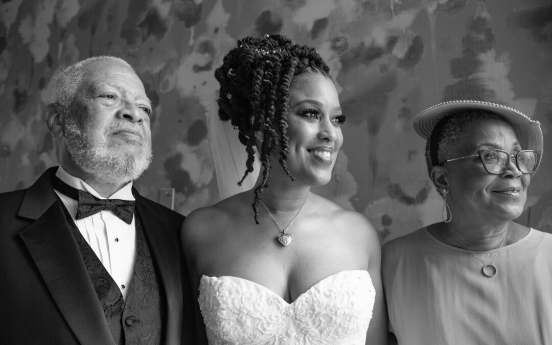 Photo of Brandi Richard Thompson and her parents on her wedding day